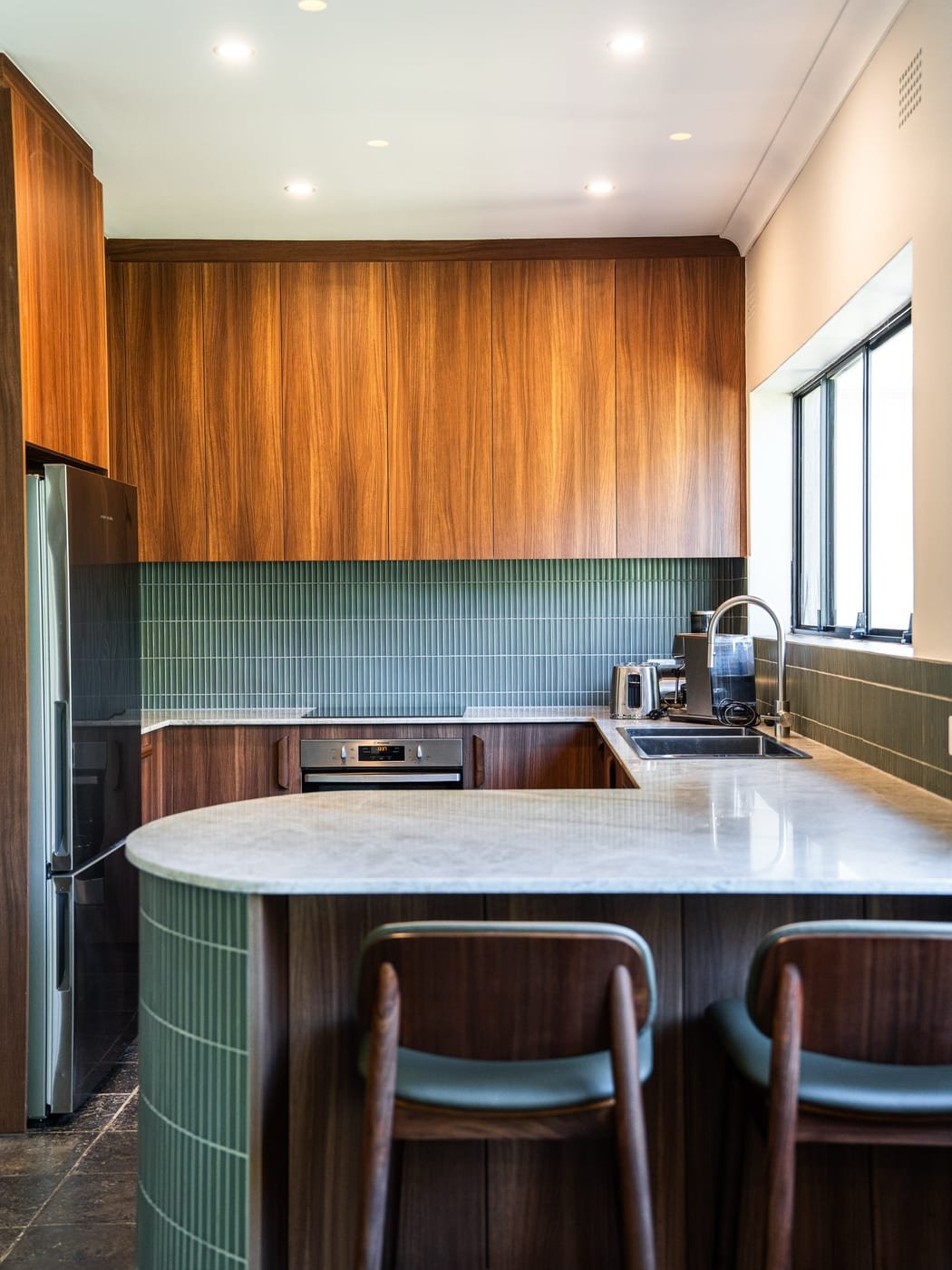 NK Kitchens & Joinery. Natural Warm timber, moody greens, and timeless details A kitchen that proves small spaces can still make a big statement…